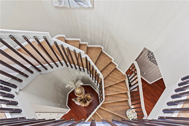 stairs with wood-type flooring