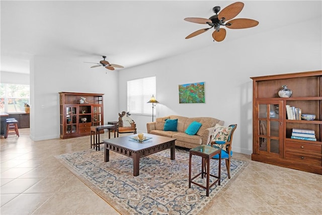 2019 Grey Falcon Cir SW, Vero Beach, FL 32962 - tiled living area featuring a ceiling fan and baseboards