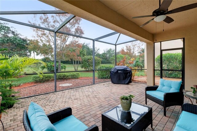 2019 Grey Falcon Cir SW, Vero Beach, FL 32962 - view of patio featuring grilling area, outdoor lounge area, ceiling fan, and glass enclosure