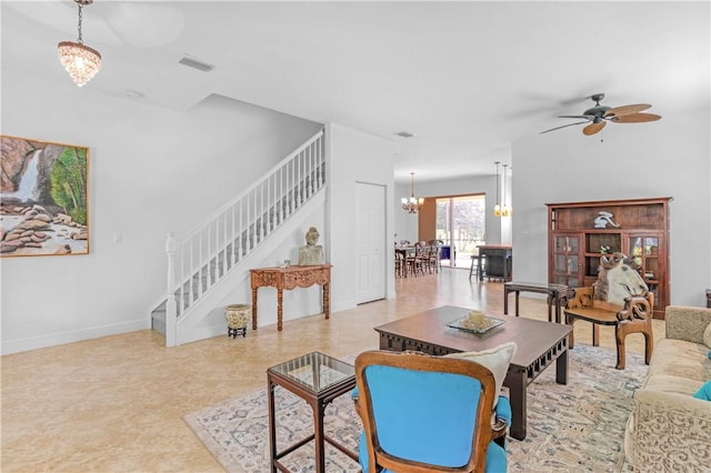 2019 Grey Falcon Cir SW, Vero Beach, FL 32962 - living area featuring stairs, a chandelier, ceiling fan, and baseboards