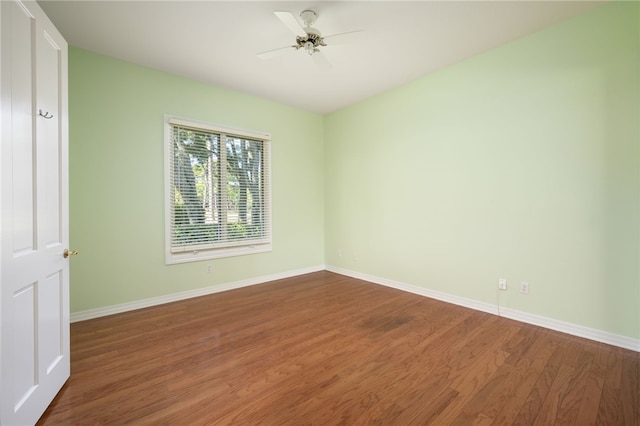 empty room featuring ceiling fan and wood-type flooring