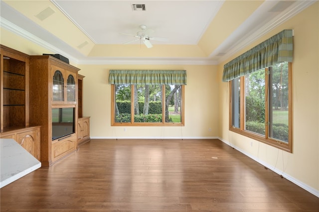 unfurnished living room featuring ornamental molding and dark hardwood / wood-style floors