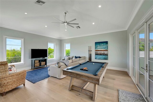 game room featuring ornamental molding, billiards, light hardwood / wood-style flooring, and a healthy amount of sunlight