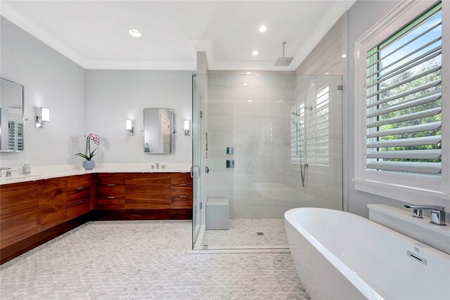 bathroom featuring independent shower and bath, vanity, and ornamental molding