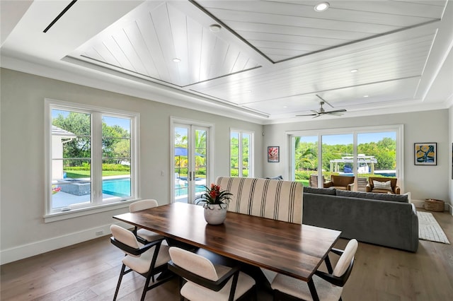 dining area with ceiling fan, dark hardwood / wood-style flooring, and ornamental molding