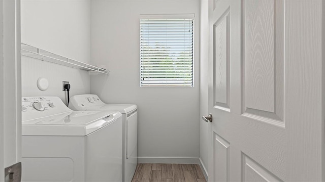 clothes washing area featuring washer and dryer