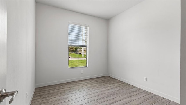 empty room with light hardwood / wood-style floors