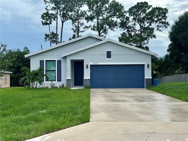 view of front of home featuring a garage and a front lawn