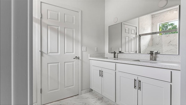 bathroom featuring vanity and a shower with shower door