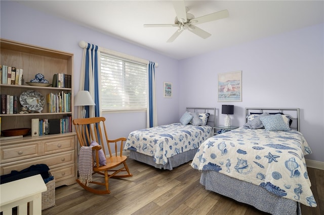 bedroom featuring wood-type flooring and ceiling fan