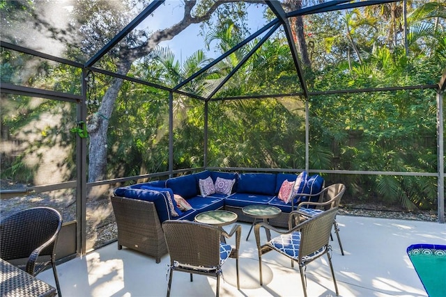 view of patio featuring an outdoor living space and glass enclosure