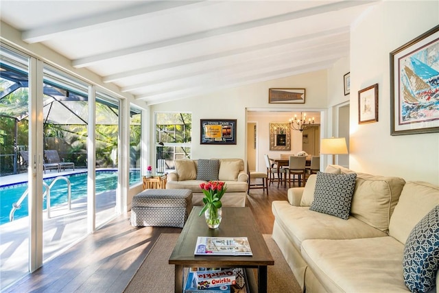 sunroom featuring vaulted ceiling with beams and a notable chandelier