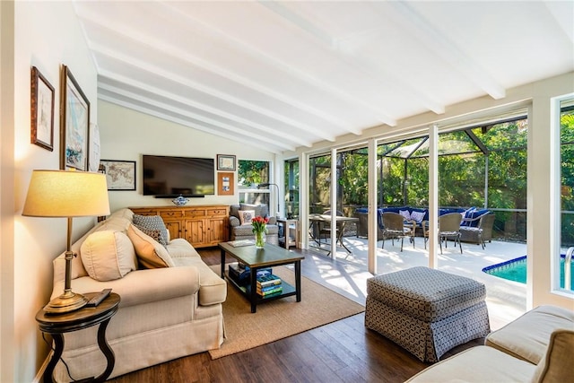 sunroom / solarium featuring lofted ceiling with beams