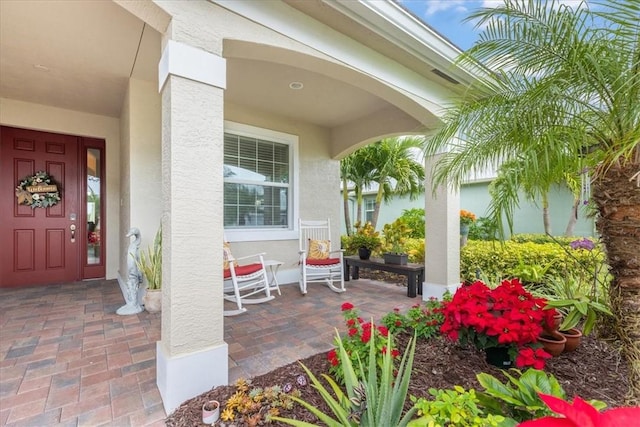 property entrance with covered porch