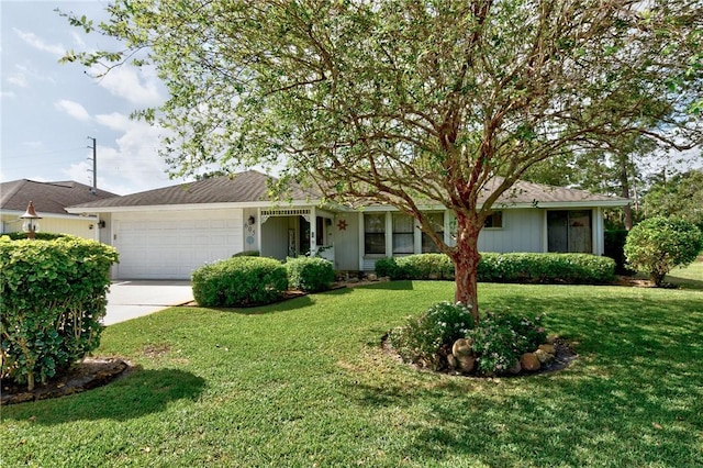 ranch-style home featuring a front yard and a garage