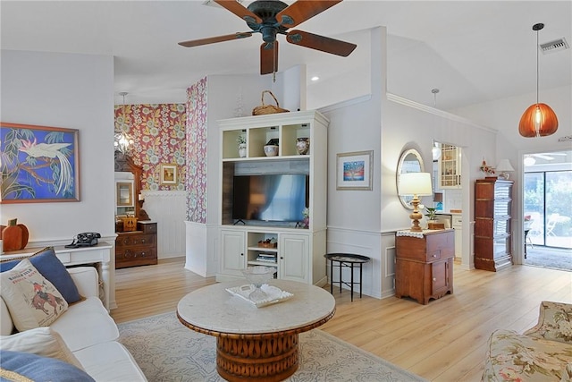 living room with ceiling fan and light hardwood / wood-style floors