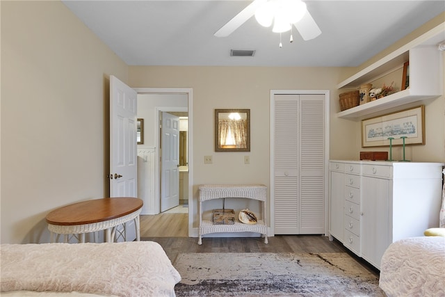 bedroom featuring hardwood / wood-style floors, a closet, and ceiling fan