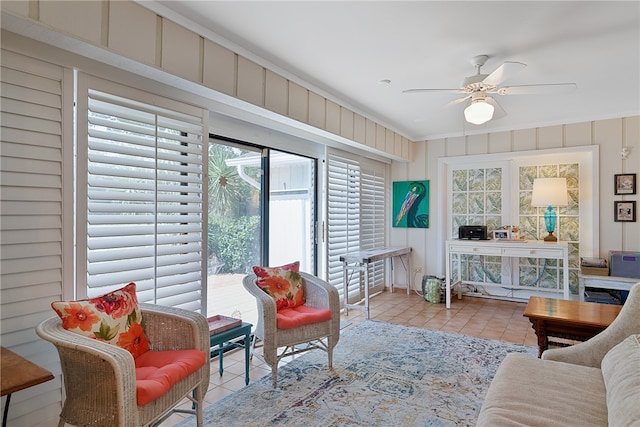 tiled living room featuring ceiling fan