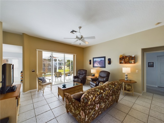 living room with light tile patterned flooring and ceiling fan