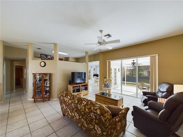 living room featuring light tile patterned flooring and ceiling fan