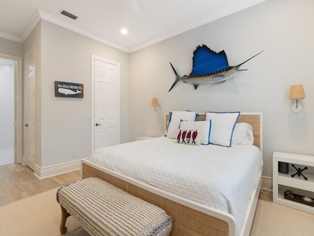 bedroom featuring light hardwood / wood-style flooring and ornamental molding