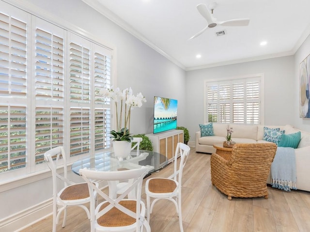 interior space featuring ornamental molding, ceiling fan, and light hardwood / wood-style flooring