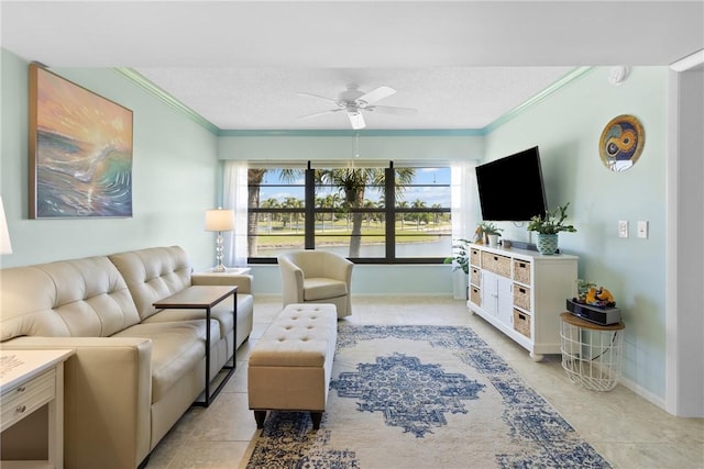 living room with plenty of natural light, ceiling fan, and crown molding