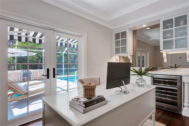 office area with french doors, ornamental molding, beverage cooler, and dark wood-type flooring