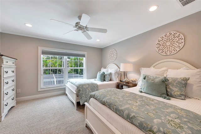 bedroom with ornamental molding, ceiling fan, and carpet flooring