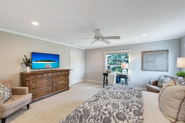 bedroom with ornamental molding, light colored carpet, and ceiling fan