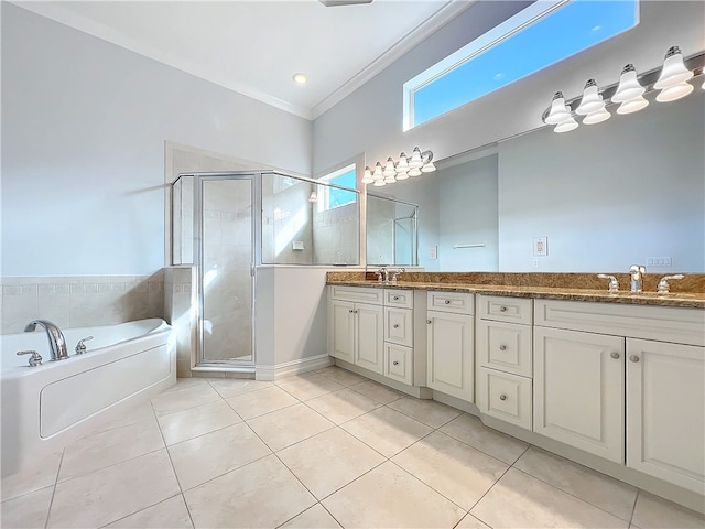 bathroom with double vanity, tile patterned flooring, a sink, and a shower stall