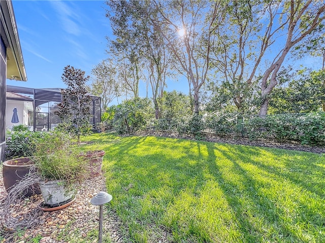 view of yard with a lanai