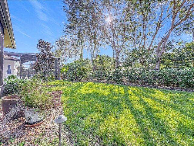 1237 River Reach Dr, Vero Beach, FL 32967 - view of yard with glass enclosure