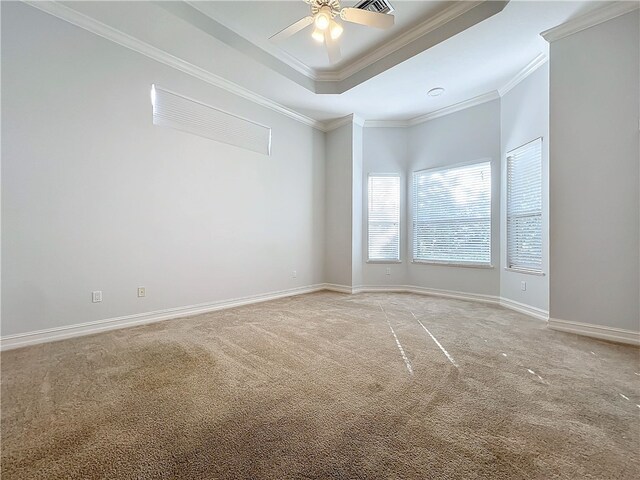 1237 River Reach Dr, Vero Beach, FL 32967 - unfurnished room featuring light carpet, ornamental molding, ceiling fan, a raised ceiling, and baseboards