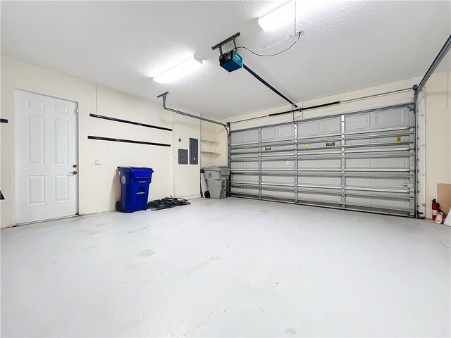 1237 River Reach Dr, Vero Beach, FL 32967 - garage featuring a garage door opener and electric panel