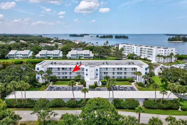 birds eye view of property featuring a water view