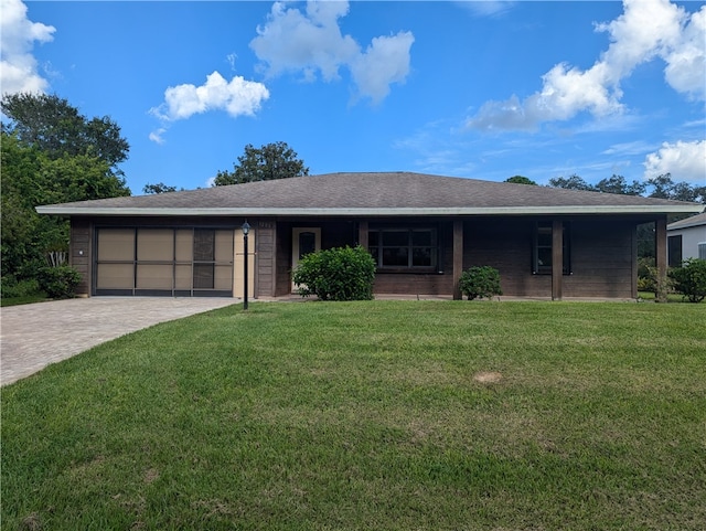 single story home with a front lawn and a garage