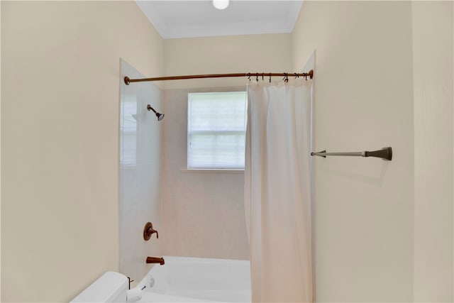 bathroom with toilet and shower / bath combination with curtain