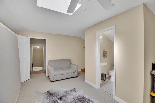 living area with lofted ceiling, light colored carpet, and ceiling fan