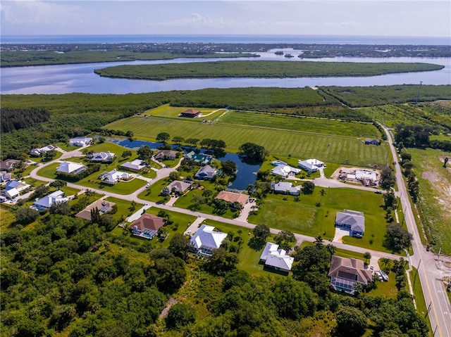 bird's eye view with a water view and a rural view