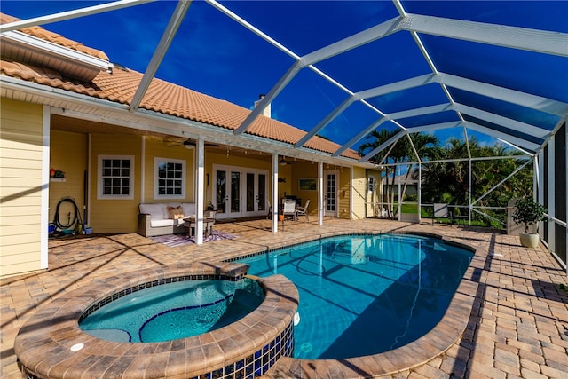 view of swimming pool with an in ground hot tub, an outdoor living space, ceiling fan, a patio, and glass enclosure