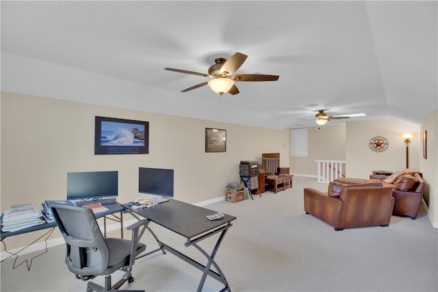 carpeted office space with lofted ceiling and ceiling fan