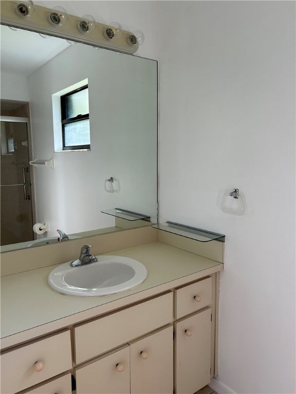 bathroom with vanity and walk in shower