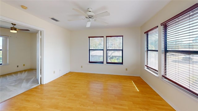 unfurnished room featuring hardwood / wood-style flooring and ceiling fan