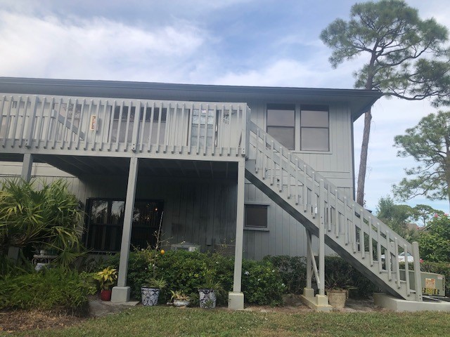 back of property with a wooden deck