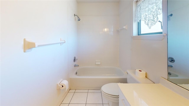 full bathroom featuring tile patterned flooring, vanity, toilet, and tiled shower / bath