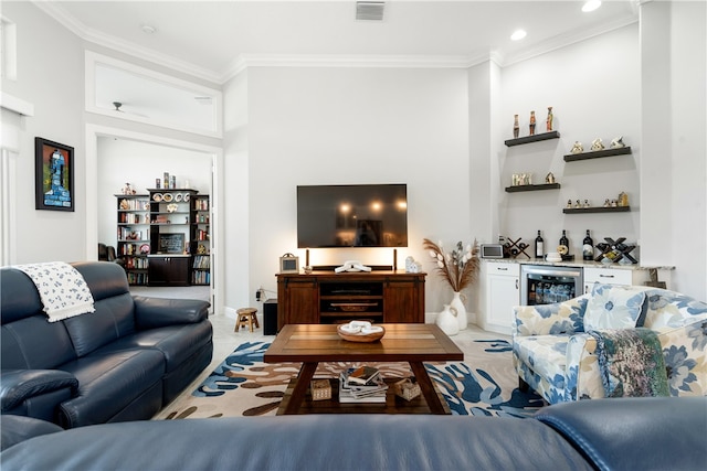 carpeted living room with wine cooler, bar, and crown molding