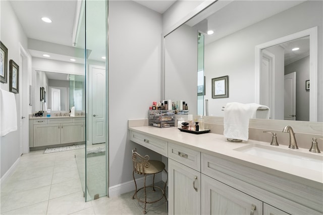 bathroom with tile patterned flooring and vanity