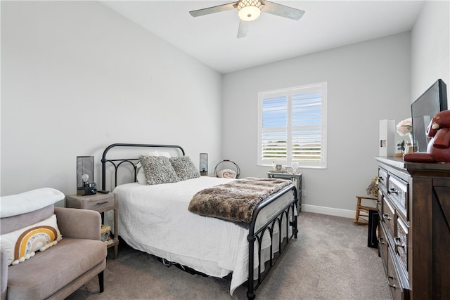 carpeted bedroom with ceiling fan and lofted ceiling