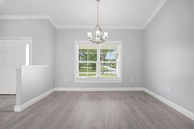 614 Stevenson Ave, Sebastian, FL 32958 - empty room featuring a chandelier, wood finished floors, and crown molding